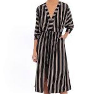 Aura Striped dress with three-quarter length sleeves.